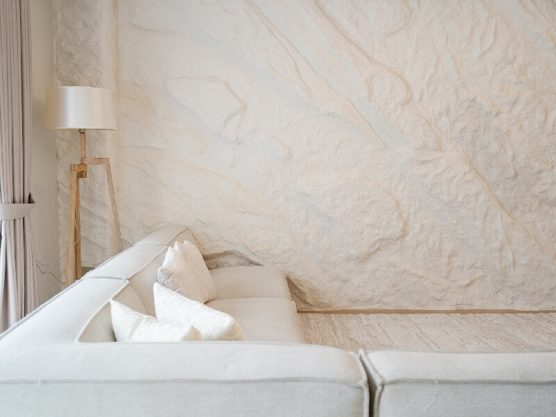 Textured wallpaper feature wall in a finished room